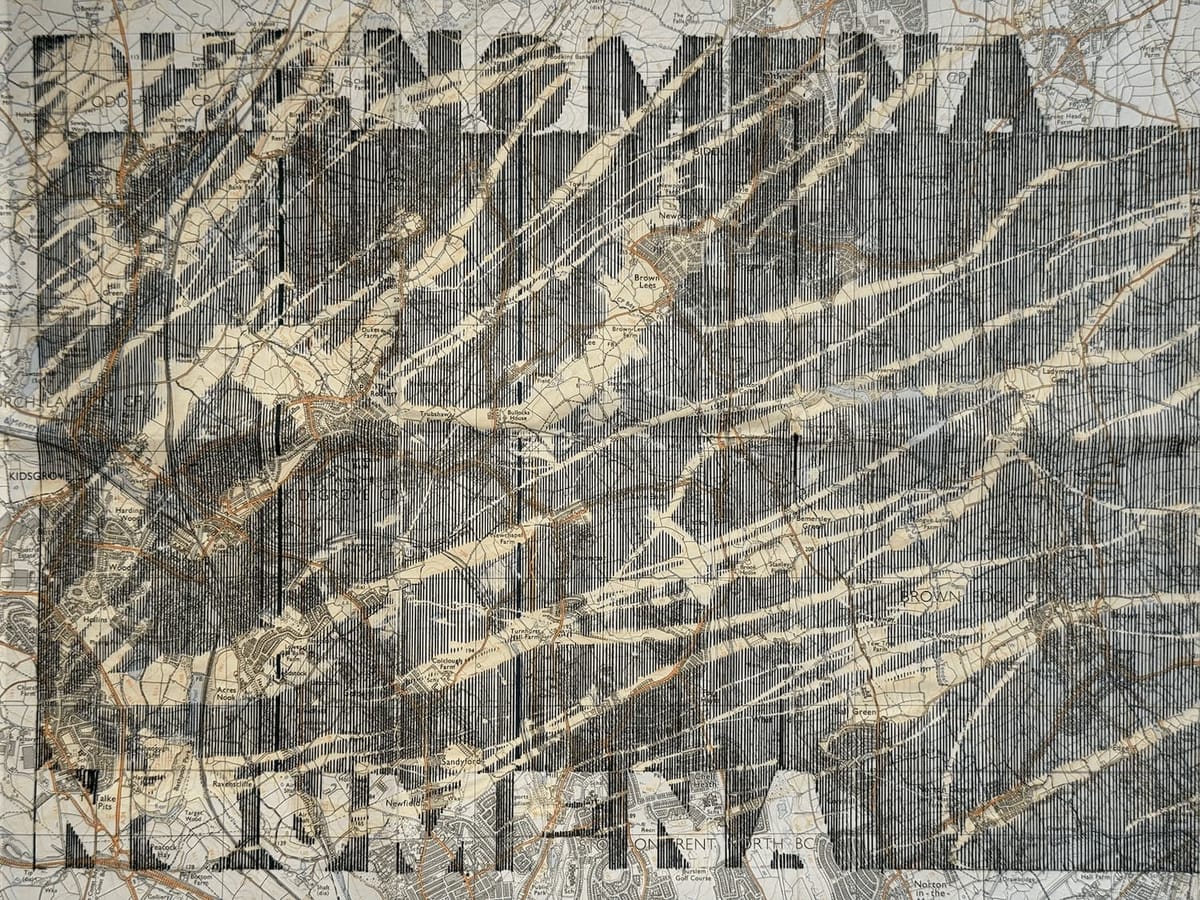 Lines drawn on a map splattered by bleach. On top of the lines the word Phenomena. On negative space of the lines, the word noumena